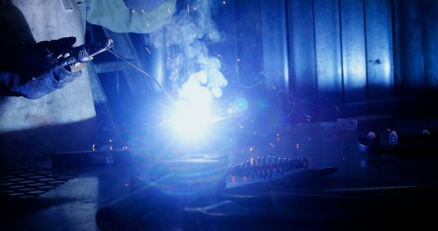 Industrial Welder Working with Metal in Low Light - Download Free Stock Images Pikwizard.com