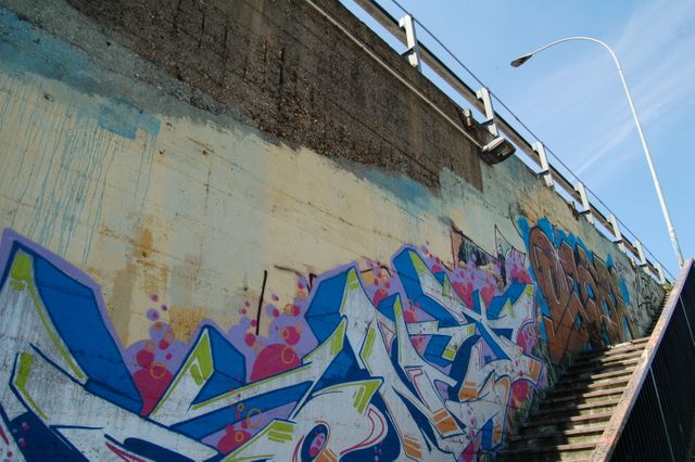 Urban Graffiti Art on Concrete Wall under Bridge - Download Free Stock Photos Pikwizard.com