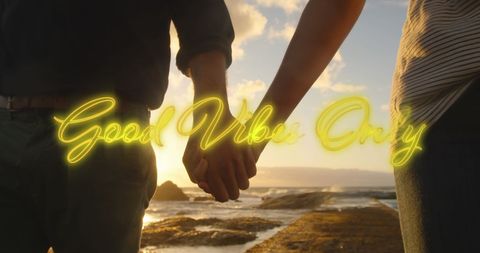 Couple Holding Hands at Sunset with Good Vibes