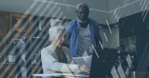 Senior Urban Financial Analysts with Laptop Analyzing Data