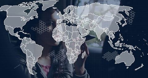 Woman holding smartphone speaking with holographic world map overlay, global connectivity