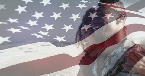 Joyful Couple Embracing on Beach with American Flag Overlay