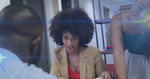Businesswoman Leading Collaborative Meeting in Modern Office