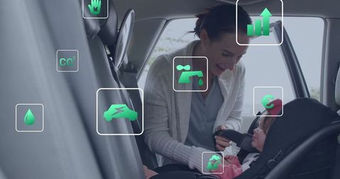 Parent secures baby in car seat with sustainability graphics