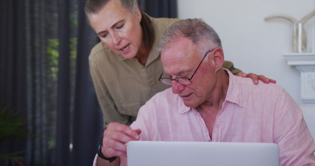 Stressed caucasian senior couple with laptop calculating finances together at home - Download Free Stock Photos Pikwizard.com