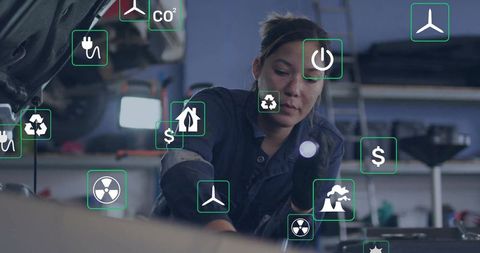 Female mechanic working with innovative eco-friendly technology