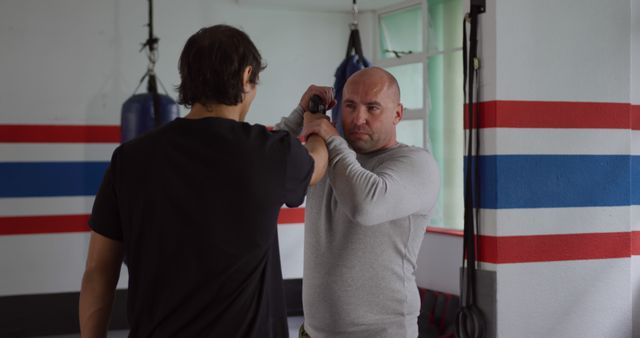 Martial Arts Instructor Teaching Self-Defense Techniques Indoor - Download Free Stock Images Pikwizard.com