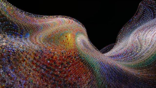 Flowing Multicolor Bead Mesh Sculpture Curving Over Black Void, Iridescent Glass