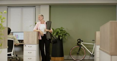 Diverse Modern Office Coworkers Promoting Wellness and Sustainability