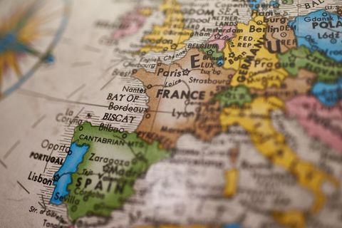 Vintage europe map showing france spain portugal with compass rose and city labels