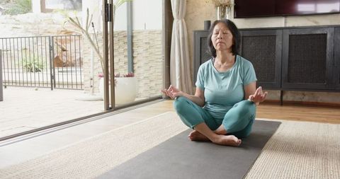 Senior Woman Practicing Meditation for Mindfulness and Wellness at Home