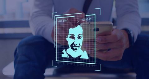 Businessman Using Smartphone with Facial Recognition Technology Overlay