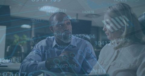 Digital data overlay with business professionals collaborating