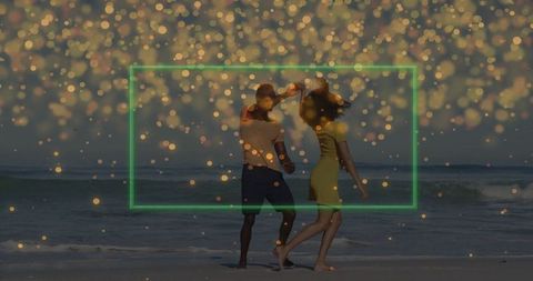 Romantic Couple Dancing by Ocean with Bokeh Lights