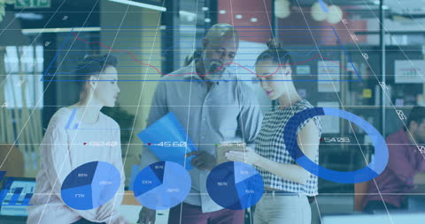 Diverse Team Analyzing Data With Digital Graphs