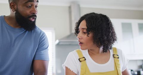 Diverse Friends Cooking Together in Kitchen Enjoying Conversation