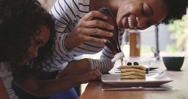 Mother and Daughter Enjoying Breakfast Pancakes Together - Download Free Stock Images Pikwizard.com