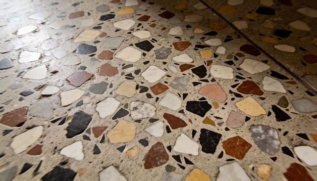 Polished terrazzo floor with multicolor marble and stone chips diagonal perspective