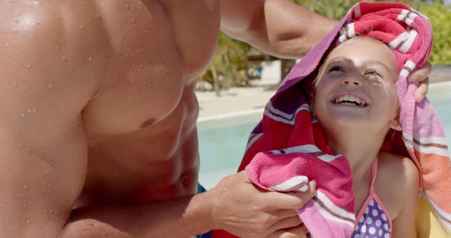 Man Drying Smiling Girl with Towel by Poolside on Sunny Day - Download Free Stock Images Pikwizard.com