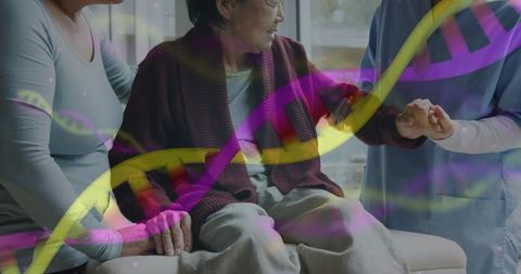 Korean senior woman receiving home caregiving support on sofa with dna overlay