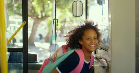 Cheerful child on school bus adventure excitedly approaching ticket machine