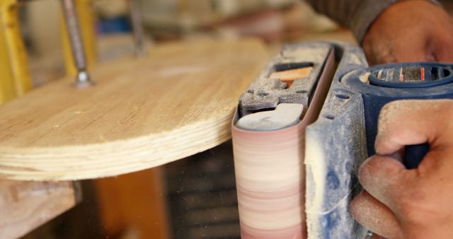 Close-up of Carpenter Polishing Wood with Electric Sander - Download Free Stock Images Pikwizard.com