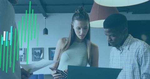 Co-Workers Analyzing Charts in Modern Office Setting