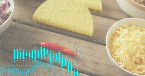 Cheddar bowl with tortilla chips and chili on rustic plank overlaid with blue data visualization