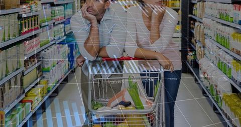 Leaning couple comparing grocery prices with digital pricing overlay in supermarket aisle