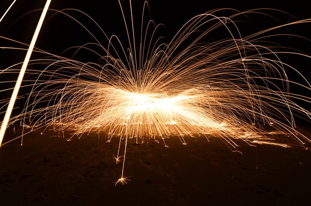 Explosion of Fireworks Against Dark Background with Bright Sparks - Download Free Stock Photos Pikwizard.com