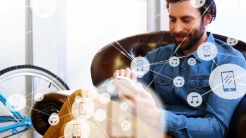 Man Using Smartphone with Digital Networking Icons in Modern Lounge
