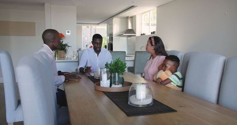 Family bonding time around kitchen table