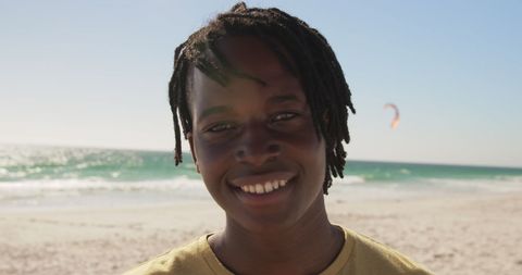 Smiling Young Adult Enjoying Sunny Beach Day - Download Free Stock Images Pikwizard.com