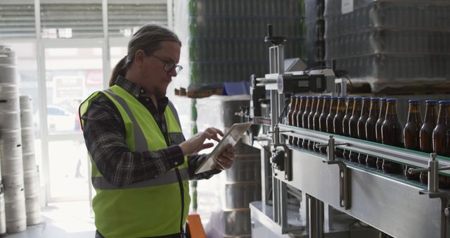 Quality Control Manager Inspecting Beverage Bottles in Factory - Download Free Stock Images Pikwizard.com