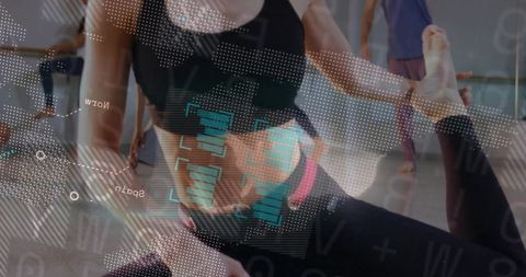 Woman stretching in activewear with futuristic hud overlay in dance studio