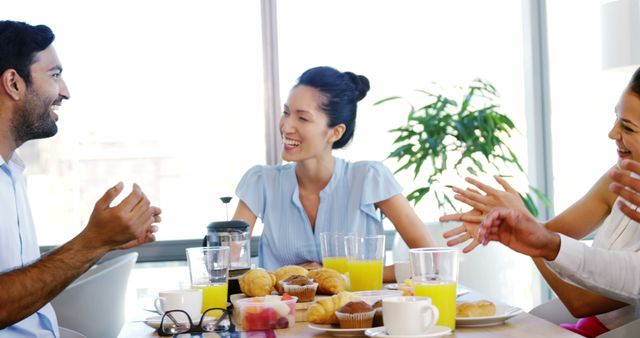 Team Members Enjoying Breakfast Together in Office - Download Free Stock Images Pikwizard.com