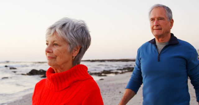 Senior Couple Walking on Beach at Sunset, Enjoying Scenic View - Download Free Stock Images Pikwizard.com