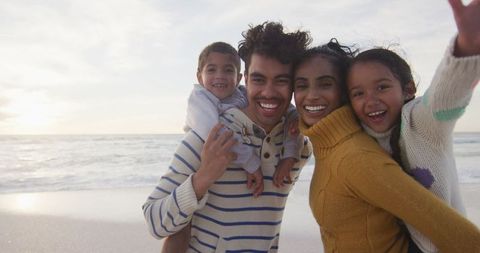 Joyful Family Enjoying Quality Time on Beach Adventure