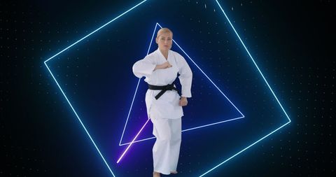 Female Martial Artist Practicing with Neon Geometric Background