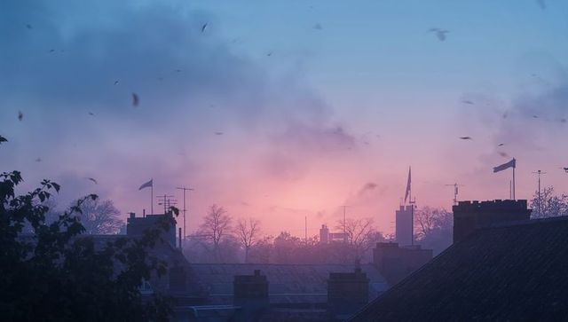 Pastel twilight rooftop skyline silhouette with chimneys and antennae