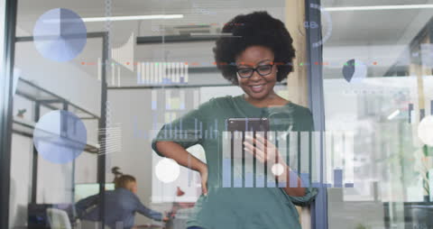 Businesswoman Analyzing Data on Tablet Device