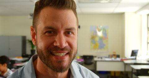 Smiling Male Teacher in Classroom - Download Free Stock Images Pikwizard.com