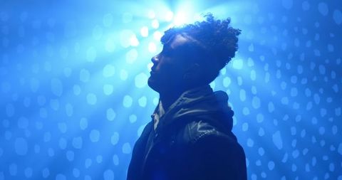 Cinematic Portrait of African American Man in Leather Jacket Under Spotlight