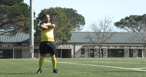 Soccer referee standing on field during sports practice