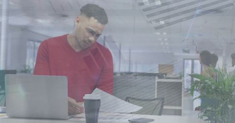 Focused Businessman Analyzing Financial Reports in Modern Office - Download Free Stock Images Pikwizard.com