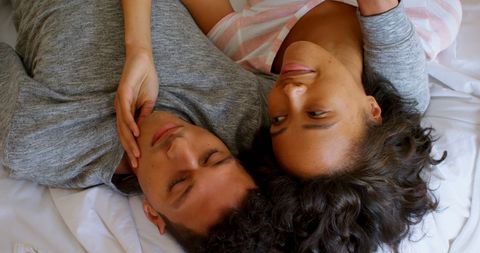 Intimate Couple Lying Close Together Sharing Affectionate Moment