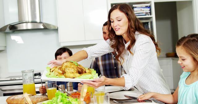 Family Enjoying Lunch at Home with Chicken Dish - Download Free Stock Images Pikwizard.com