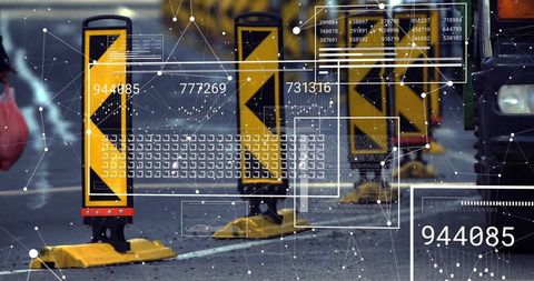 Guiding wet roadway with yellow chevron delineators and networked digital data overlay