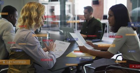 Team Reviewing Reports in Modern Office Showing Digital Notifications and UI Overlays