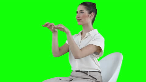 Businesswoman Simulates Typing in Front of Green Screen
